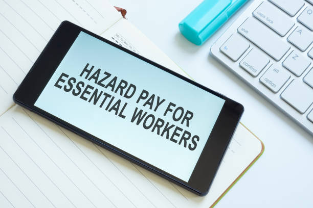 istock Info about Hazard pay for essential workers on smartphone. 1338879338