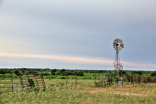 A windmill in a field near Fentress Texas