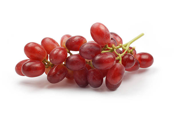 Red grapes on white background stock photo