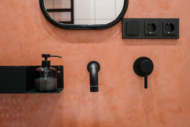 istock Closeup at bathroom interior, wall with faucet, crane. 1338880661