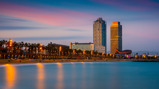Panoramic view of a Barcelona beach at sunset