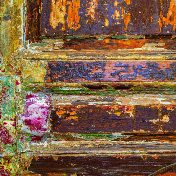 Stained and splattered with bright paint wooden wall. Textured Colorful background