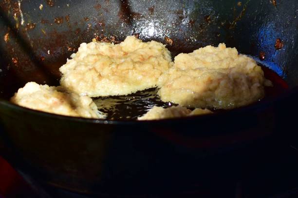 istock potato balls on background of preheated cast-iron pan 1338881246