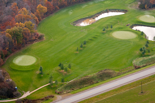 Aerial photo of golf course's water trap, fairway and green