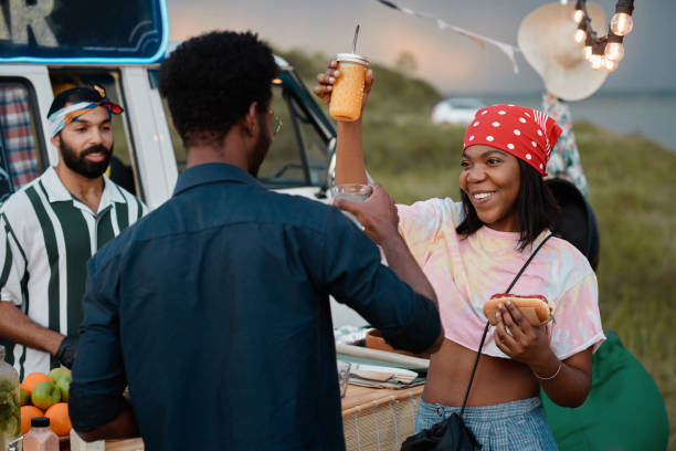 istock Young people having fun at party outdoors 1338884768