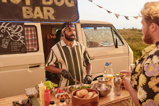istock Man preparing sandwiches at party 1338884836