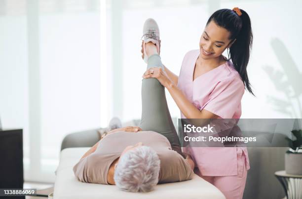 Shot Of An Older Woman Doing Light Exercises During A Session With A Physiotherapist Inside Stock Photo - Download Image Now