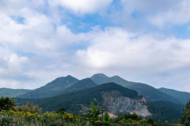 Free Stock Photo of Green mountains under a bright blue sky with clouds ...