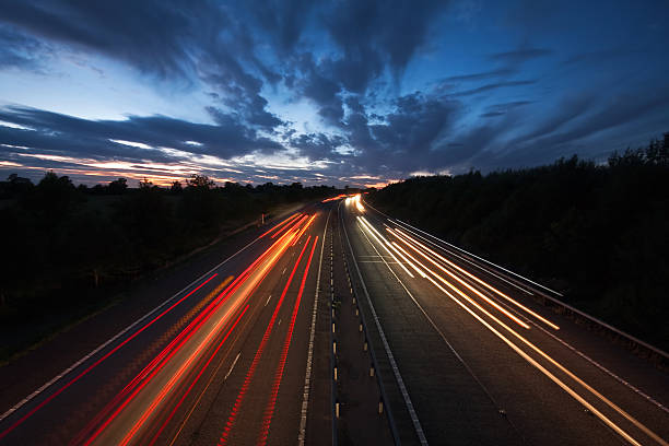 istock Light trails on a motorway at dusk 133888692