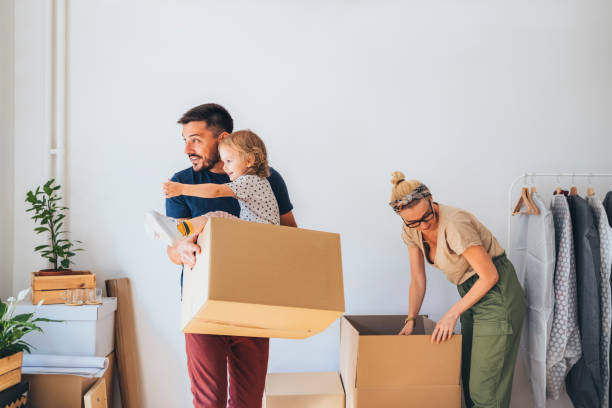 istock Moving In: Young Family Moving In New Home 1338887363
