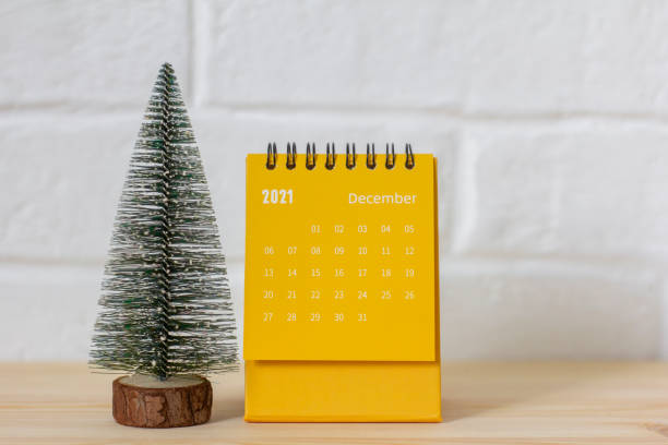 istock The calendar is December 2021.A desktop calendar and a small Christmas tree on the table. 1338891762