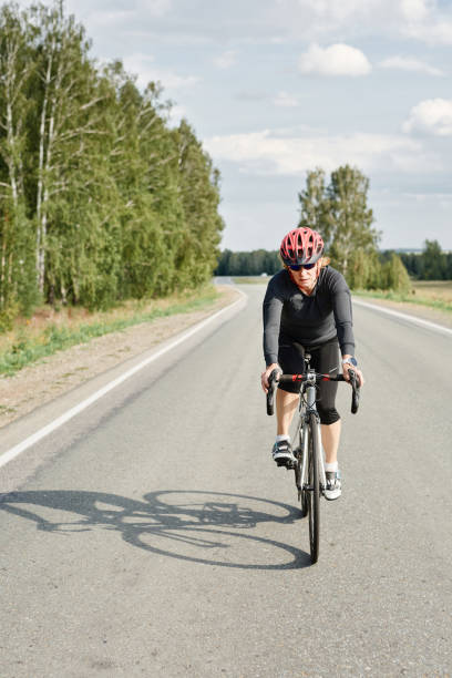 istock Woman riding on a mountain bike 1338892464