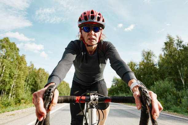 istock Athlete woman riding on a bicycle 1338892500