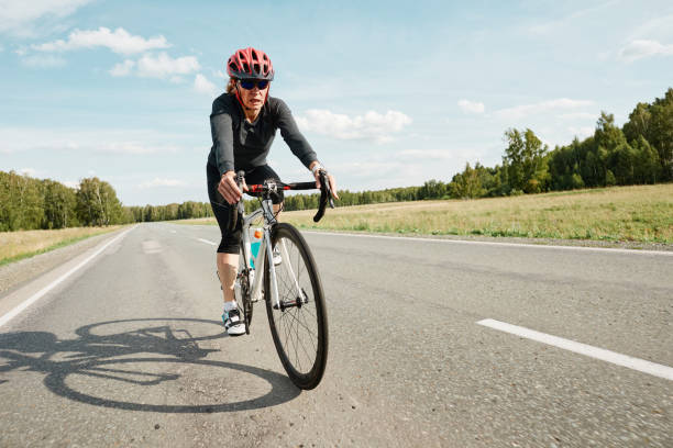 istock Woman riding on biking road 1338892515
