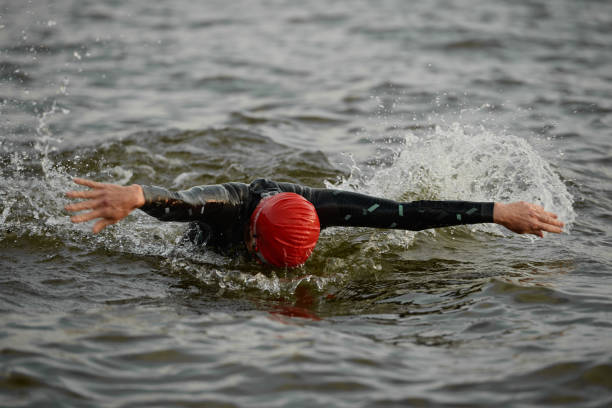 istock Determined woman swimming in sea 1338892608