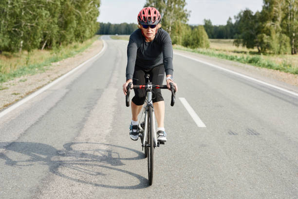 istock Woman making downhill with mountain bike 1338892640