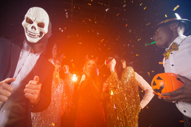 istock People dancing on Halloween party 1338893040