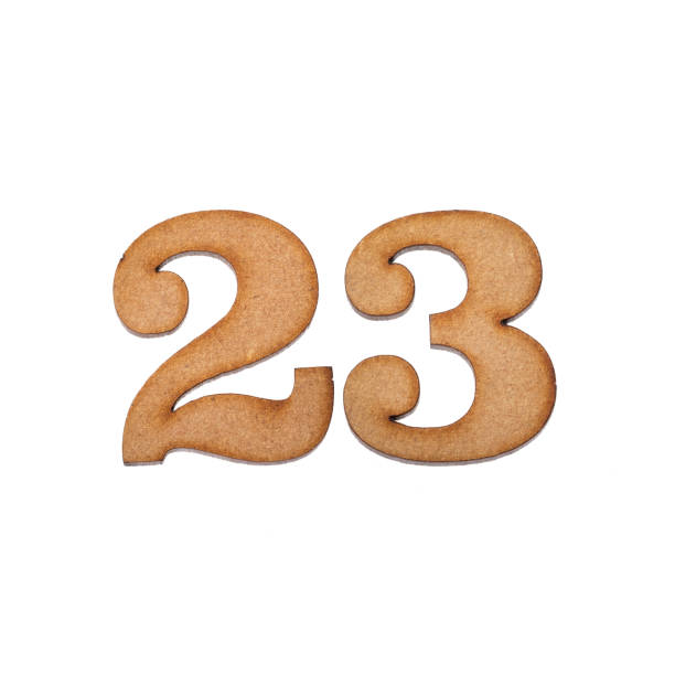 istock Number 23 in wood, isolated on white background 1338894746