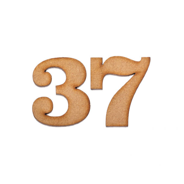 istock Number 37 in wood, isolated on white background 1338894864