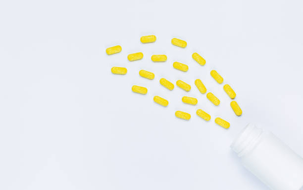 istock pills and pill bottles on white background,Assorted pharmaceutical medicine pills, tablets and capsules and bottle on white background. Top view. Flat lay. Copy space. Medicine concept. Heap of pills on white background 1338896162