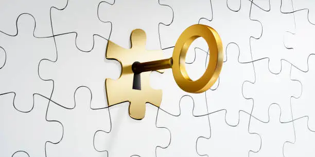 White Jigsaw Puzzle with golden Puzzle Piece and Key