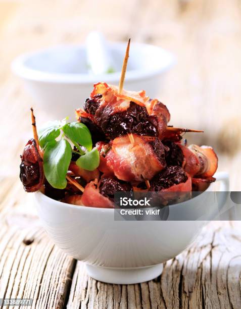 Prunes Wrapped In Rashers Of Bacon Detail Stock Photo - Download Image Now - Bacon, Plum, Dried Plum