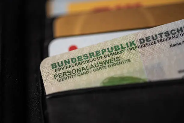 extreme close-up of German ID card in black leather wallet