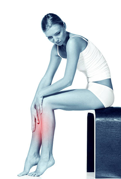 istock young harmonious girl massages the thin and long tired feet. 133890076