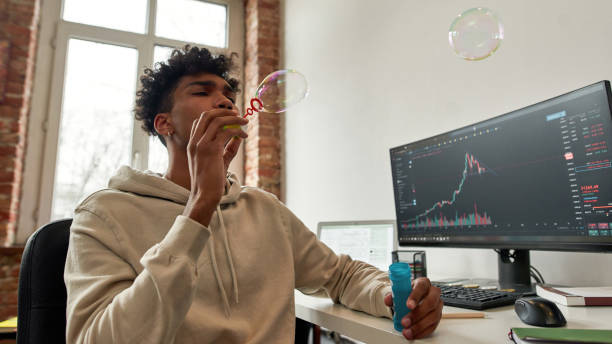 istock Millennial ethnic man relax trade online from home make soapbubbles 1338901357