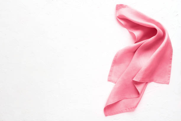 Beautiful pink serving napkin isolated on white background