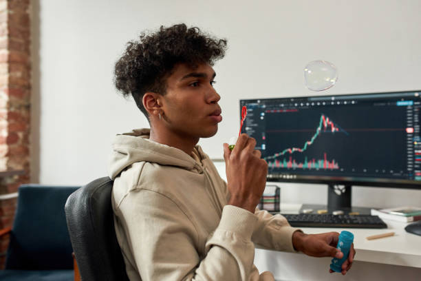 istock Ethnic man trader earn online relax at home 1338901761