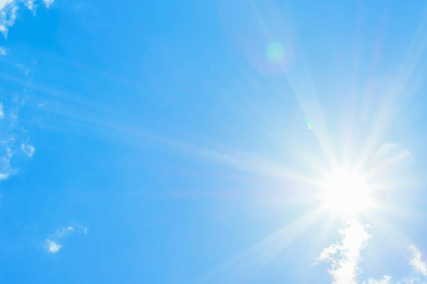 istock Bright sun with beautiful beams in the sky with light clouds 1338902111