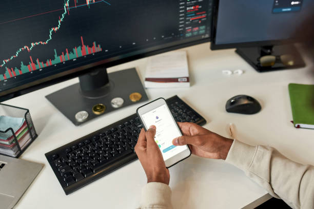 istock Close up man trade online on gadgets from home 1338905339