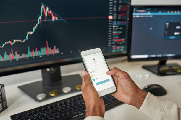 istock Close up man investor trade online using gadgets 1338905432