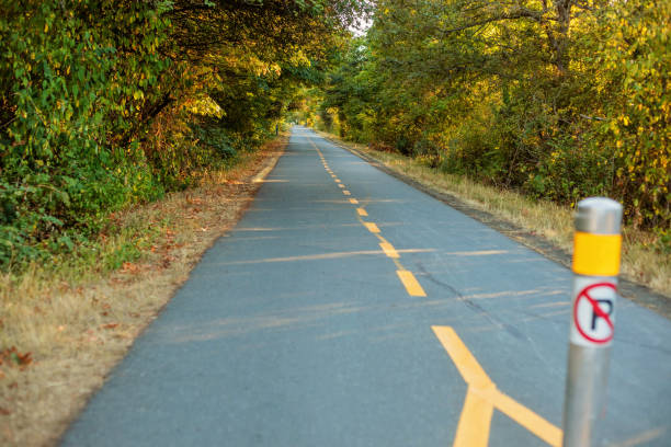 Galloping Goose Regional Trail The evening light hits an empty Galloping Goose Regional Trail in Saanich/Victoria, BC saanich peninsula photos stock pictures, royalty-free photos & images