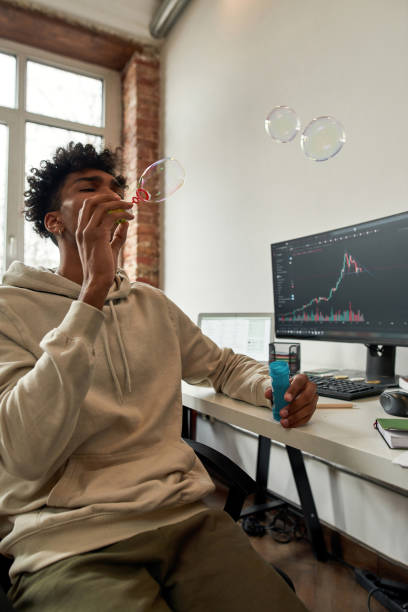 istock Ethnic millennial male trader relax earning online 1338905572