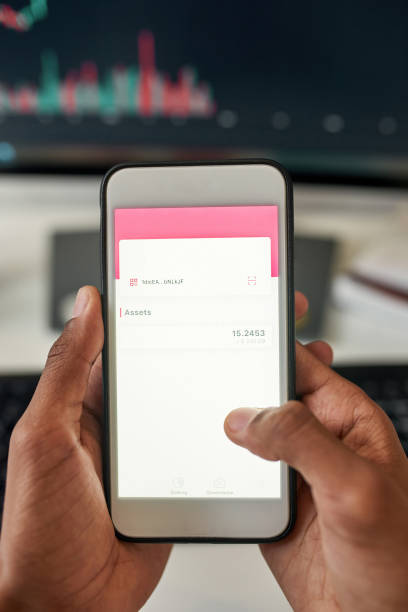 istock Close up of man use smartphone check financial graphs 1338907028
