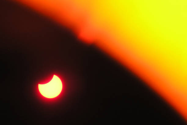 istock Solar eclipse. Full moon or lunar with light on sky in dark at night sky background. 1338909240