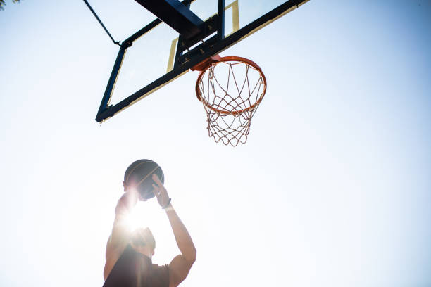 istock A fit young man jumping to make the shot under the backboard 1338913163