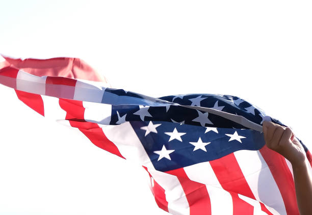 istock A waving with the wind US american flag against white background 1338914194