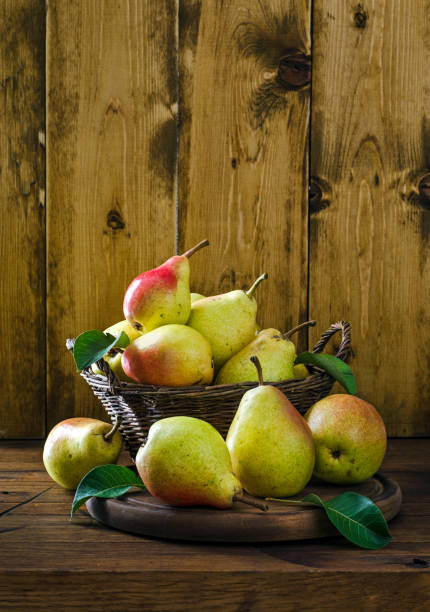 istock Fresh pears in basket on the table 1338915877