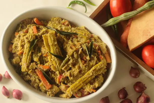 Aviyal is a popular Kerala dish and it is an essential part of the meal. It is a thick mixture of many vegetables commonly found in the region and coconut, seasoned with coconut oil and curry leaves.