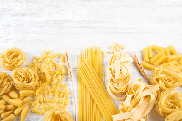 istock Italian Pasta on Rustic Wooden Table 1338918294