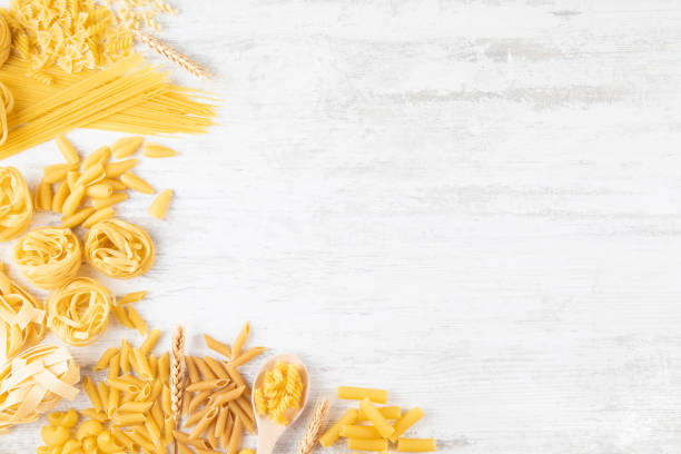 istock Different Types of Italian Pasta on Rustic Wooden Table 1338918366