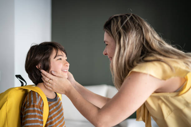 istock Mother talking to son before he leaves to school 1338922560