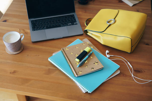 Laptop and school supplies on the table