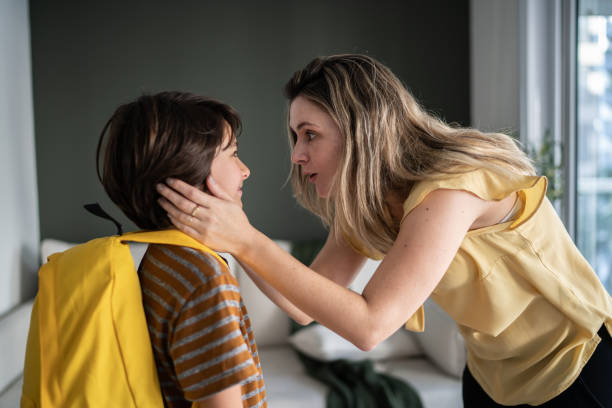 istock Mother talking to son before he leaves to school 1338922845