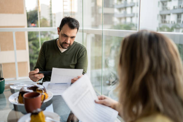 istock Couple doing home finances during breakfast at home 1338923808