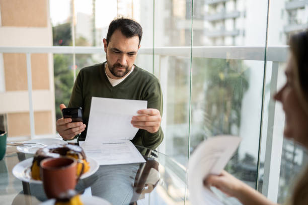istock Couple doing home finances during breakfast at home 1338923896