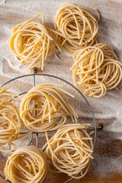 istock Italian pasta nest. Uncooked spaghetti nest. 1338923950